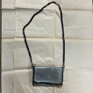 Textured gray leather bag with dark silver/black hardware. Tan interior.